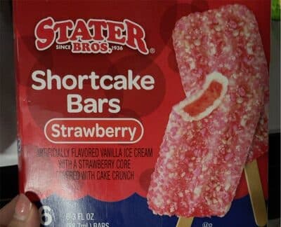 Strawberry vanilla ice cream with a strawberry